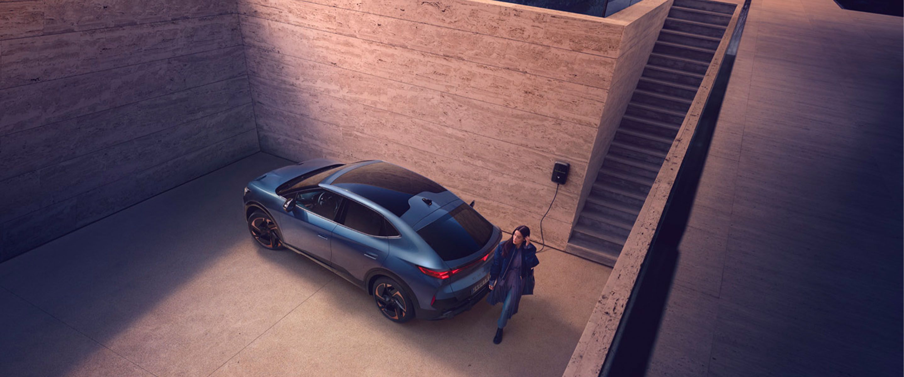 cupra electric vehicle at charging point, parking space, staircase and birds eye view